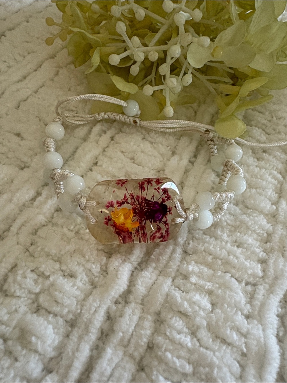 Handmade White Cord Bracelet with Encased Floral Bead
